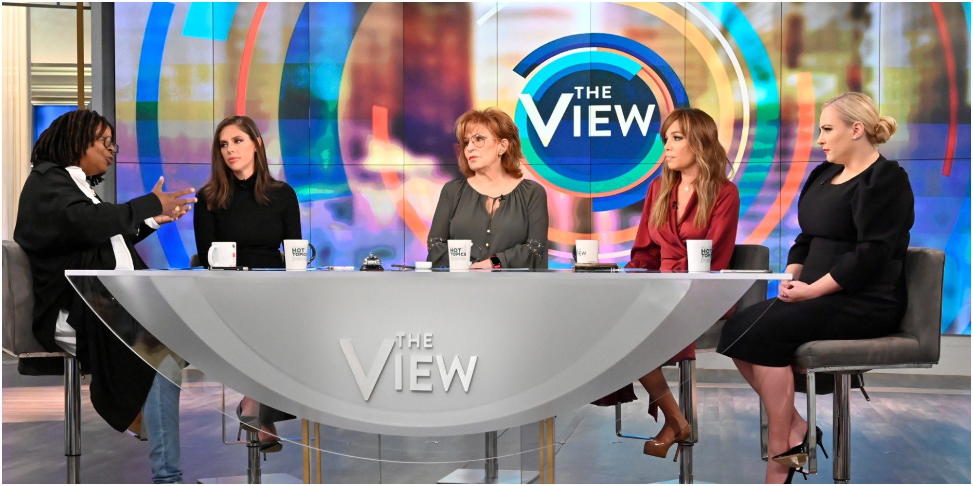 The cast of season 22 of the view including Whoopi Goldberg, Abby Huntsman, Joy Behar, Sunny Hostin, and Meghan McCain.