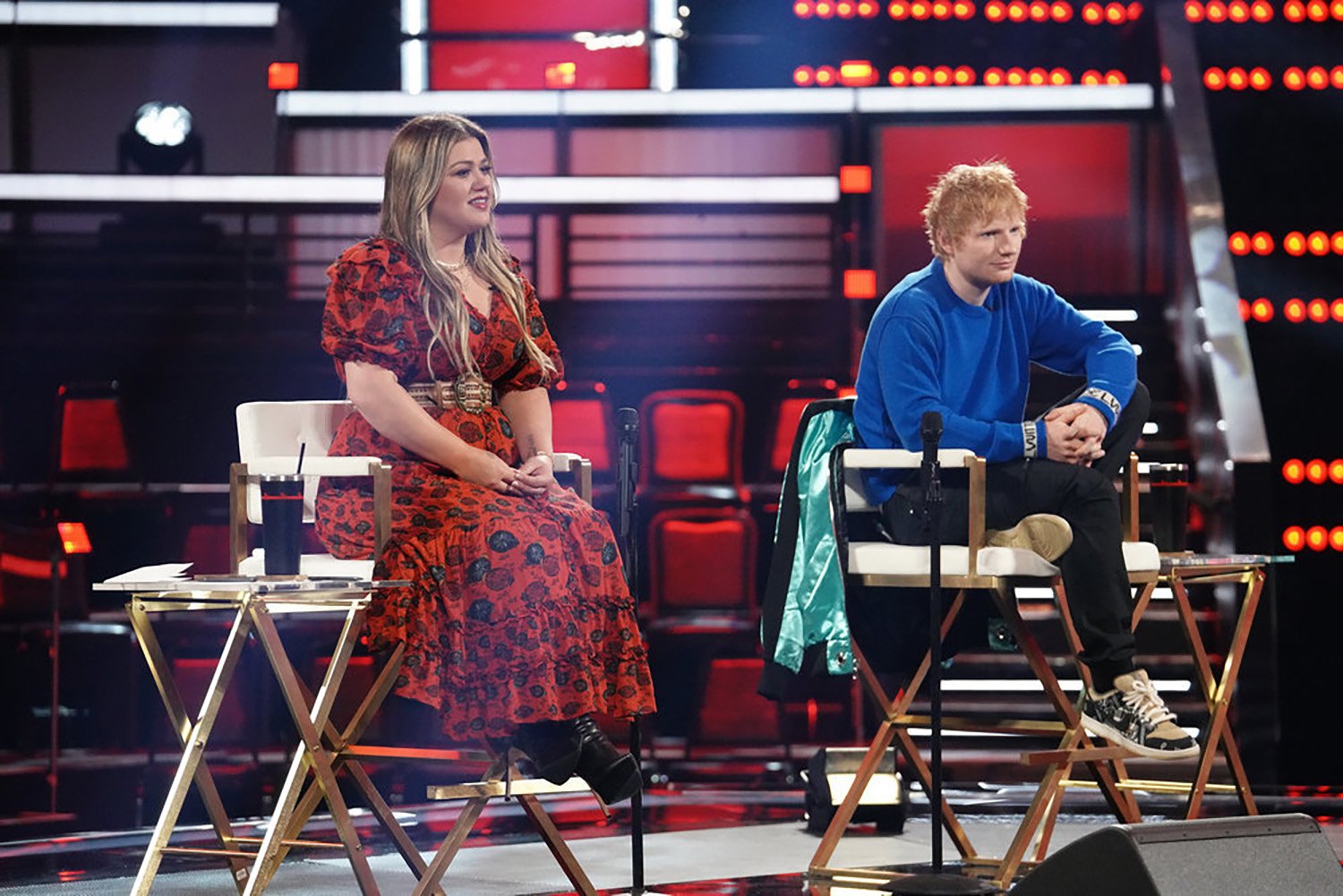 Kelly Clarkson and Ed Sheeran sit in Knockout Round rehearsals on The Voice.
