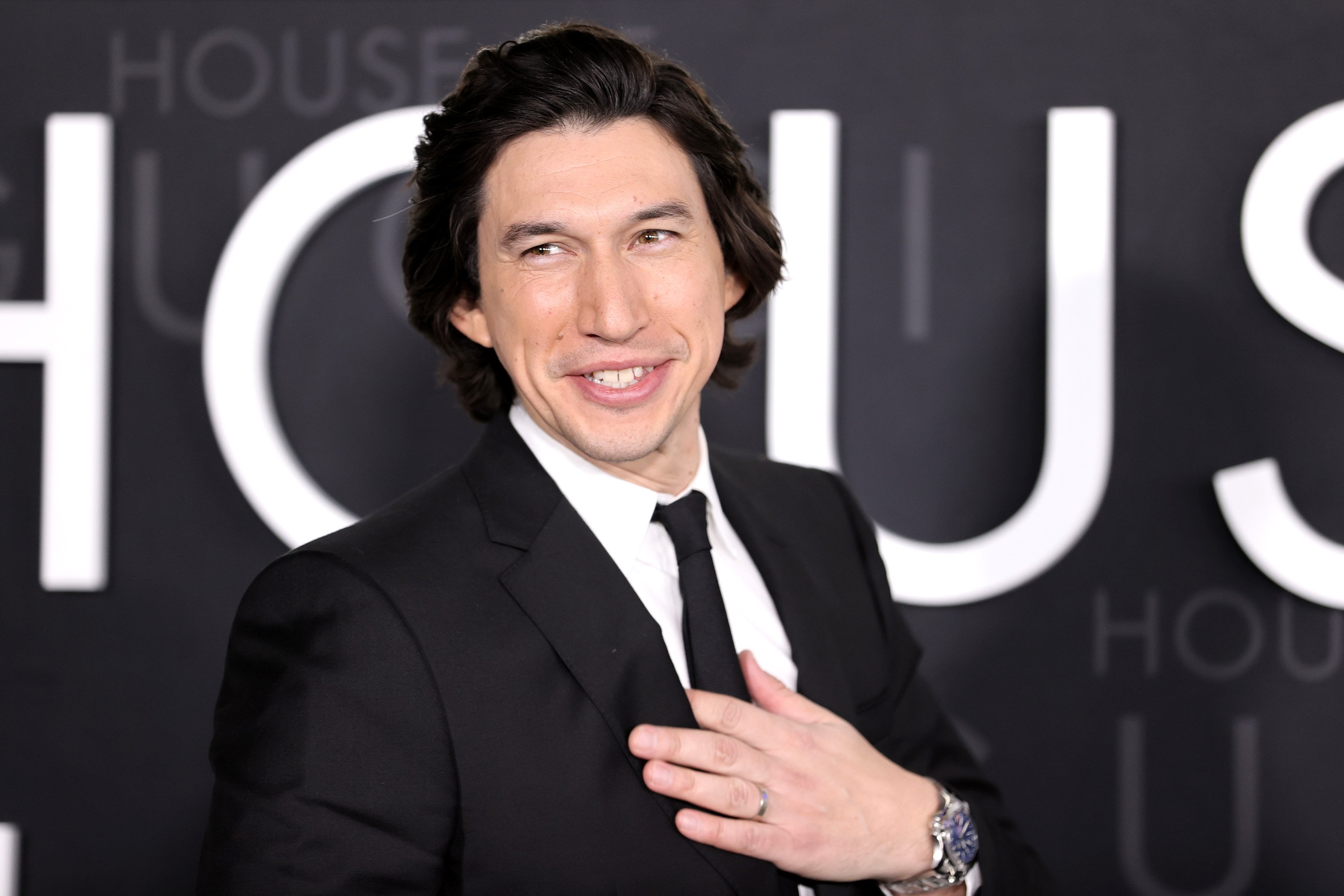 Adam Driver smiles at the 'House of Gucci' premiere in Los Angeles