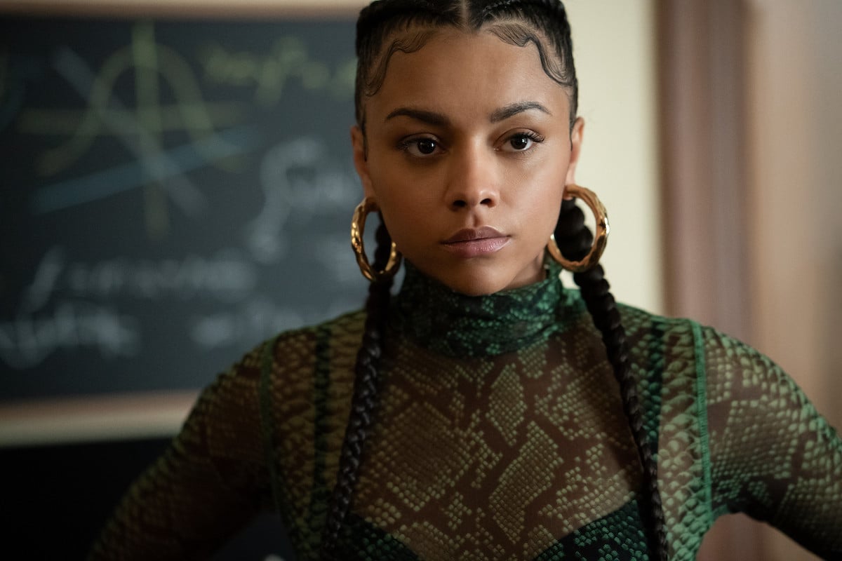 Alix Lapri as Effie in a sheer shirt and gold hoops in 'Power Book II: Ghost'