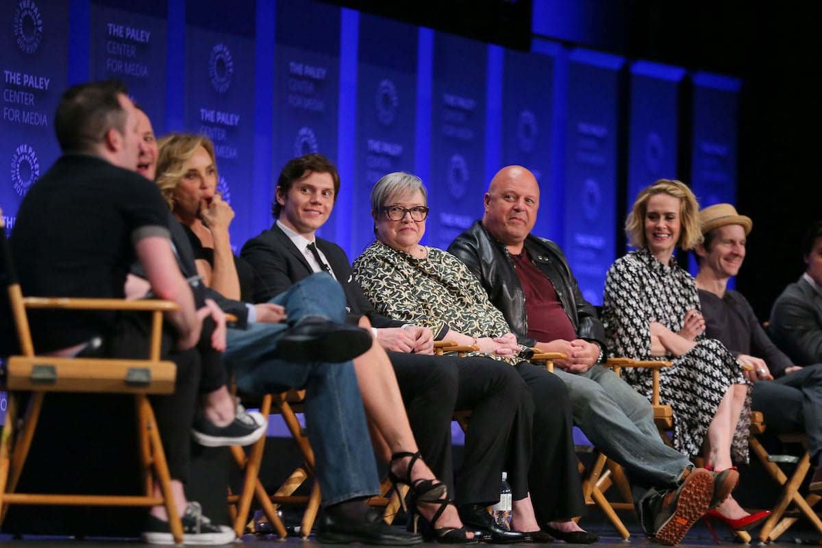 American Horror Story cast Evan Peters, Kathy Bates, Michael Chiklis, Sarah Paulson, and Denis O'Hare speak to moderators at a panel event