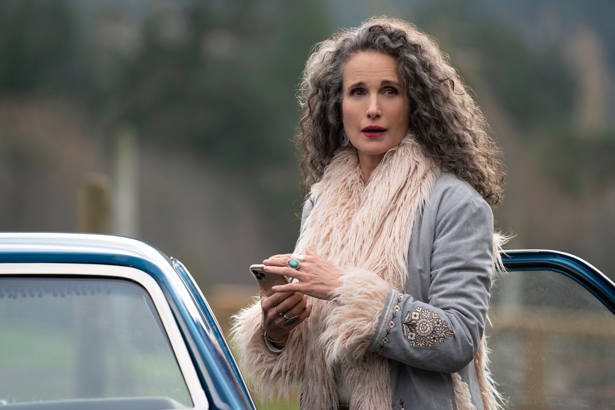 Andie MacDowell wearing a gray, fur coat in 'Maid' Season 1.