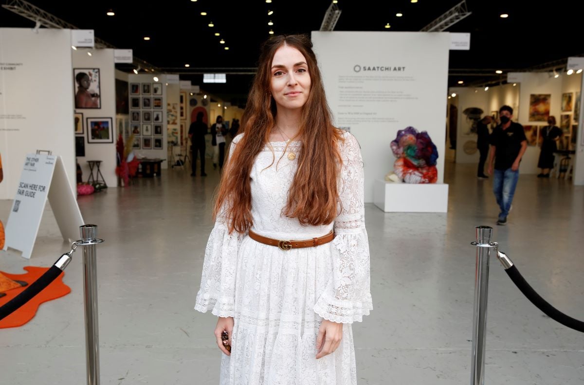 Anna Marie Tendler in a white dress with her hair down