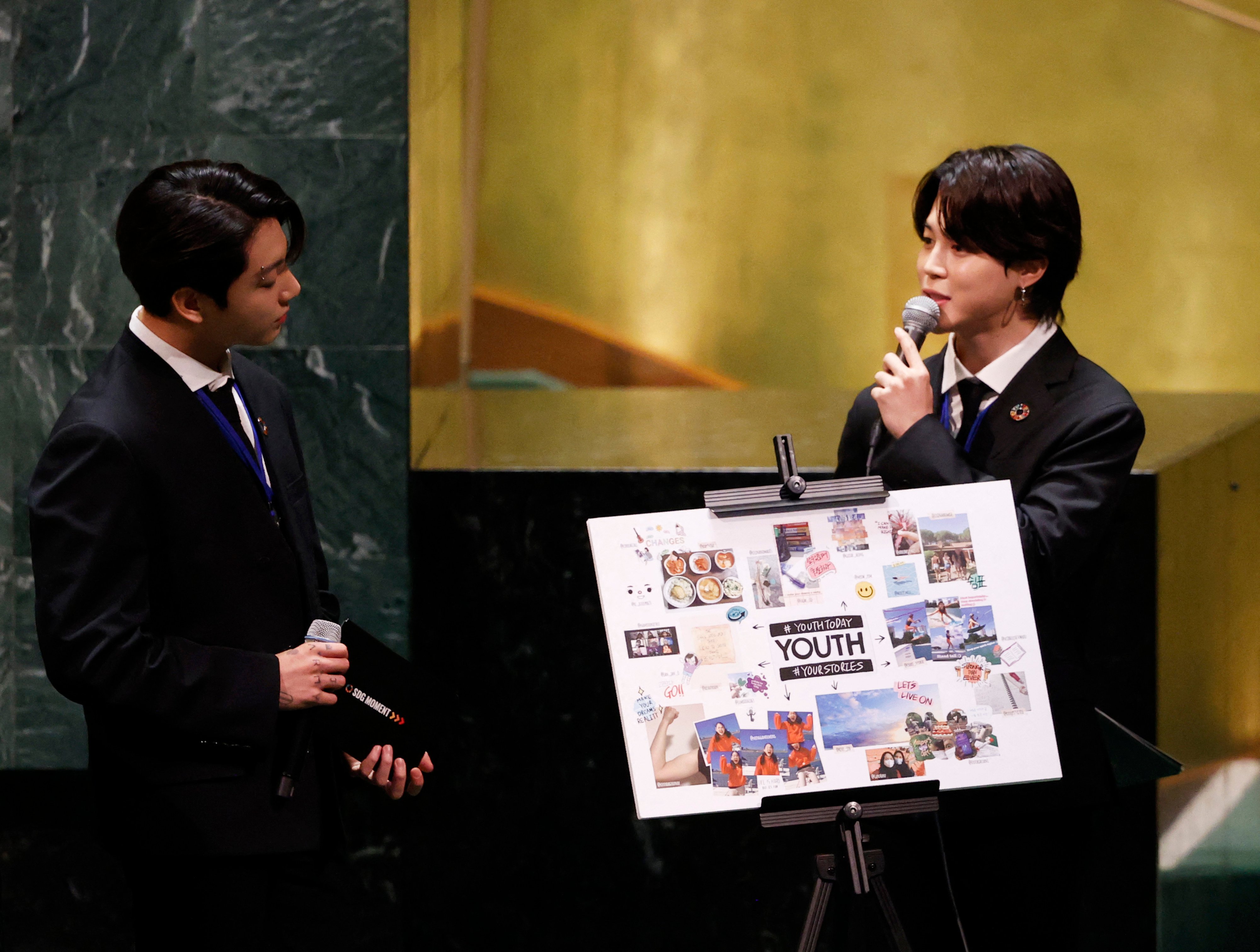 Jungkook listens as Jimin of the South Korean boy band BTS speaks at the SDG Moment event as part of the UN General Assembly