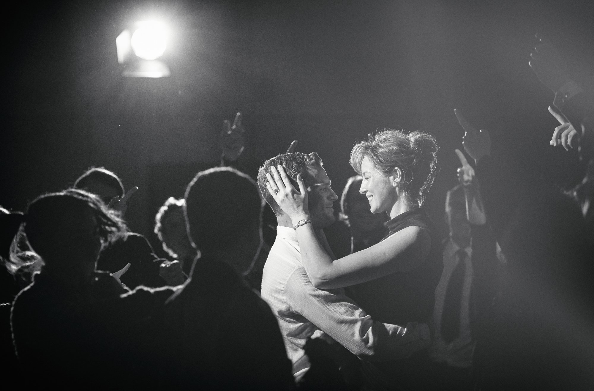 'Belfast' Jamie Dornan as Pa and Caitriona Balfe as Ma dancing together in a crowd