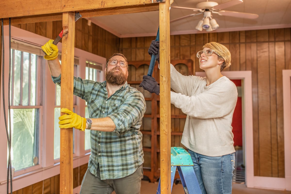 Ben Napier and Erin Napier working on a house in 'Home Town'