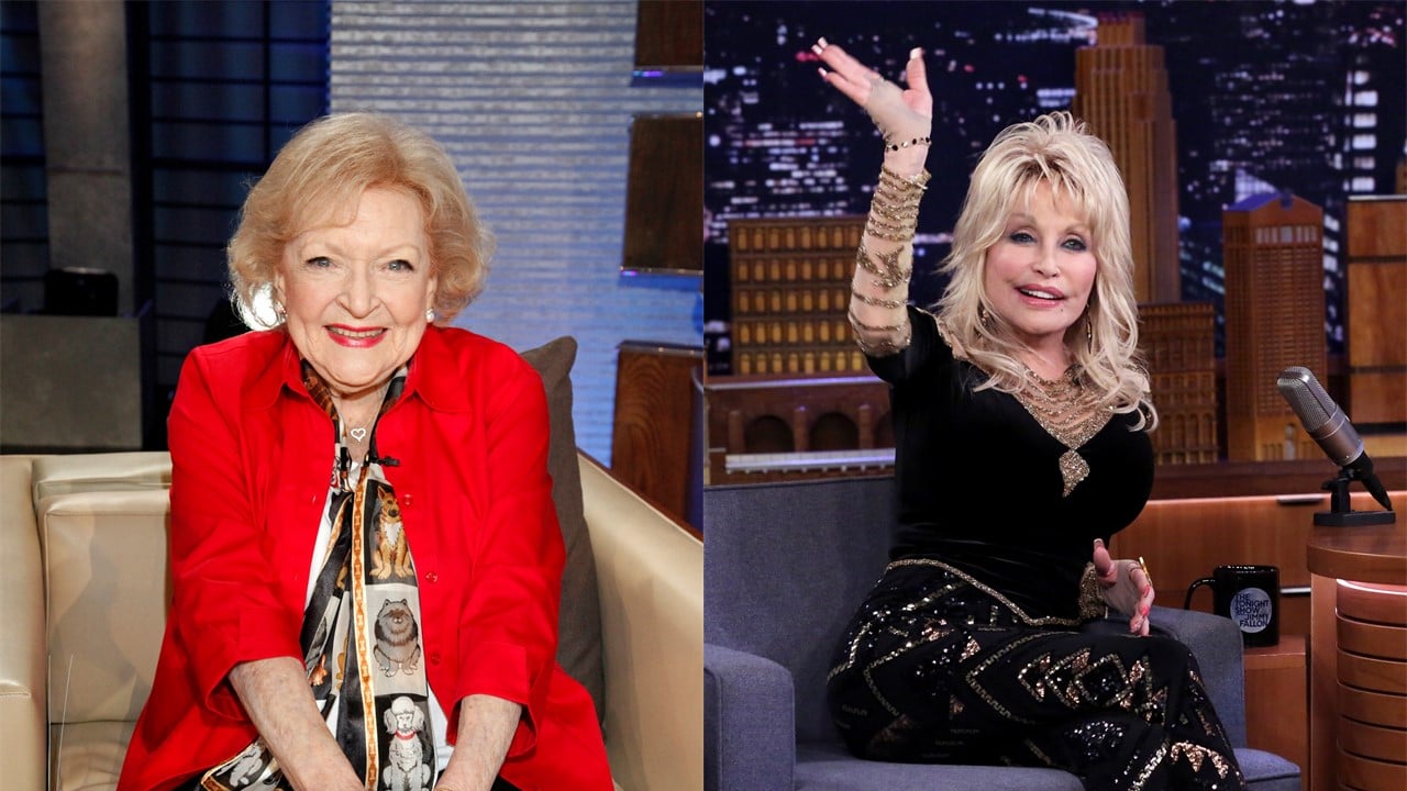 (L) Betty White sits in a chair with her hands in her lap, smiling, dressed in a red suit (R) Dolly Parton sits and waves, dressed in a black pantsuit
