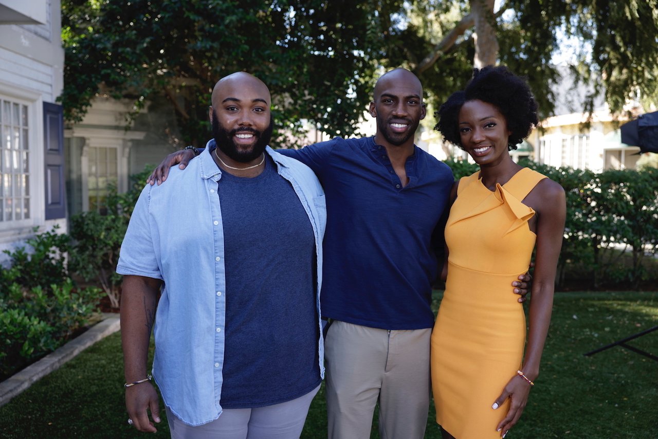 Finalists from the CBS series Big Brother 23 Derek Frazier, Xavier Prather, and Azah Awasum pose together smiling.