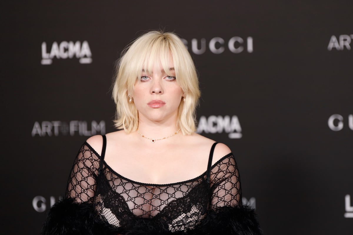 Billie Eilish wears black and stares into the camera.