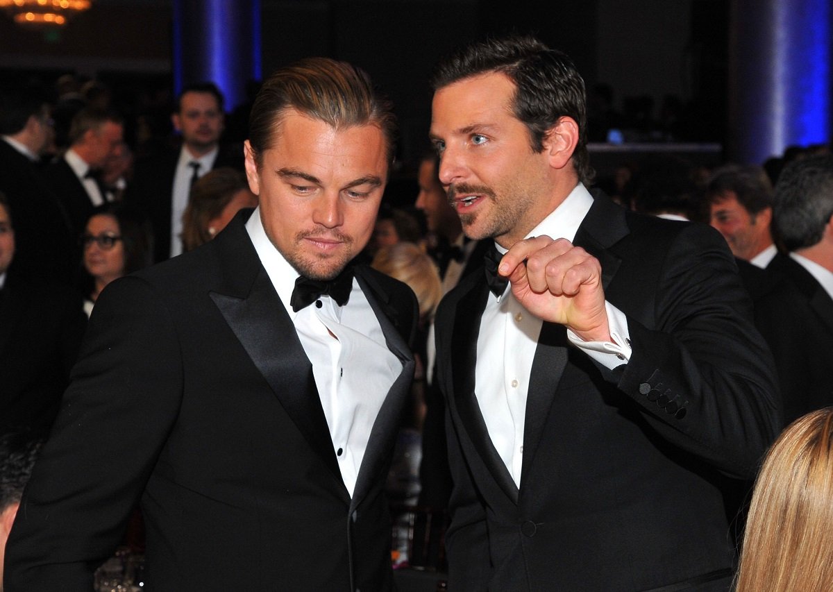 Bradley Cooper and Leonardo DiCaprio talking to each other