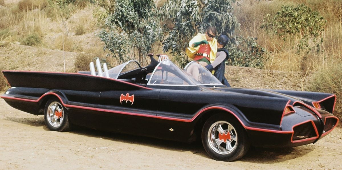 Burt Ward and Adam West getting into the Batmobile on 'Batman'
