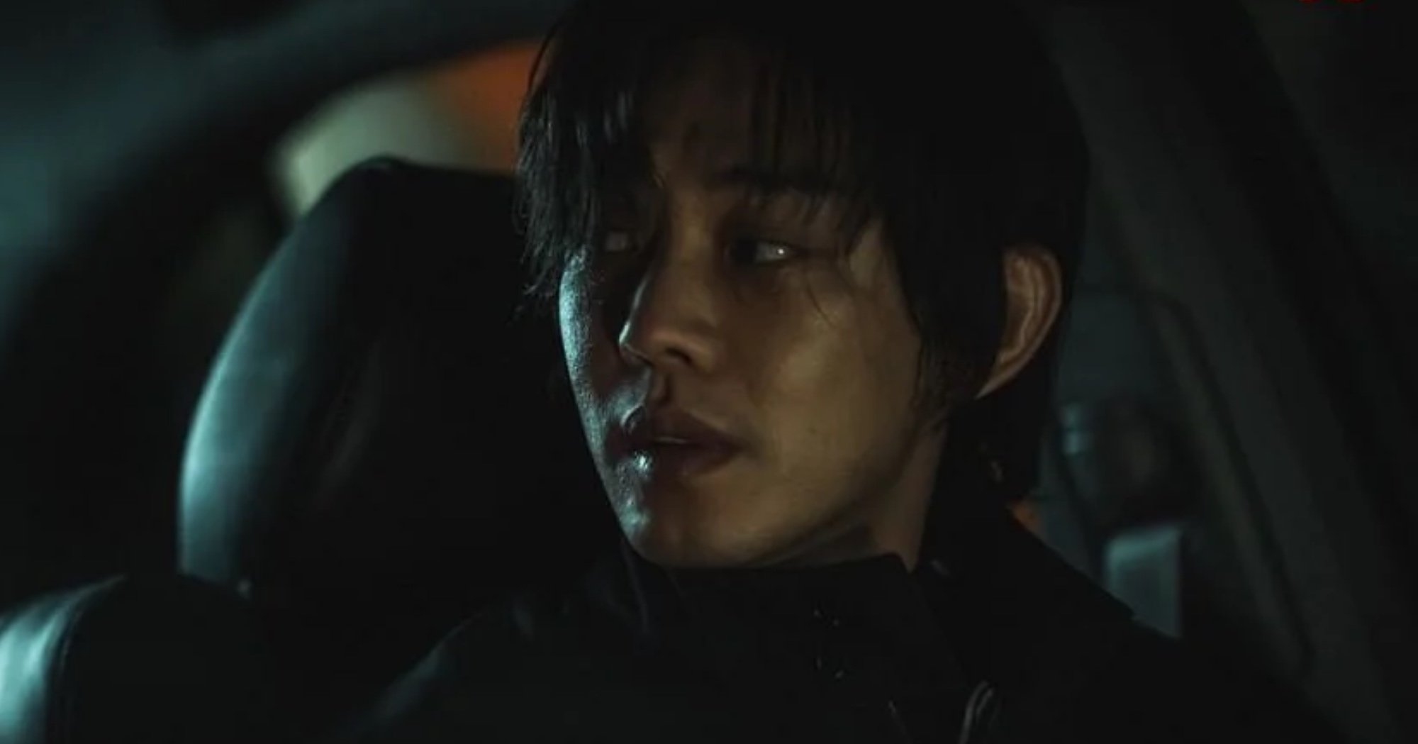 Character Jung Jin-soo from 'Hellbound' on Netflix in darkly lit car.