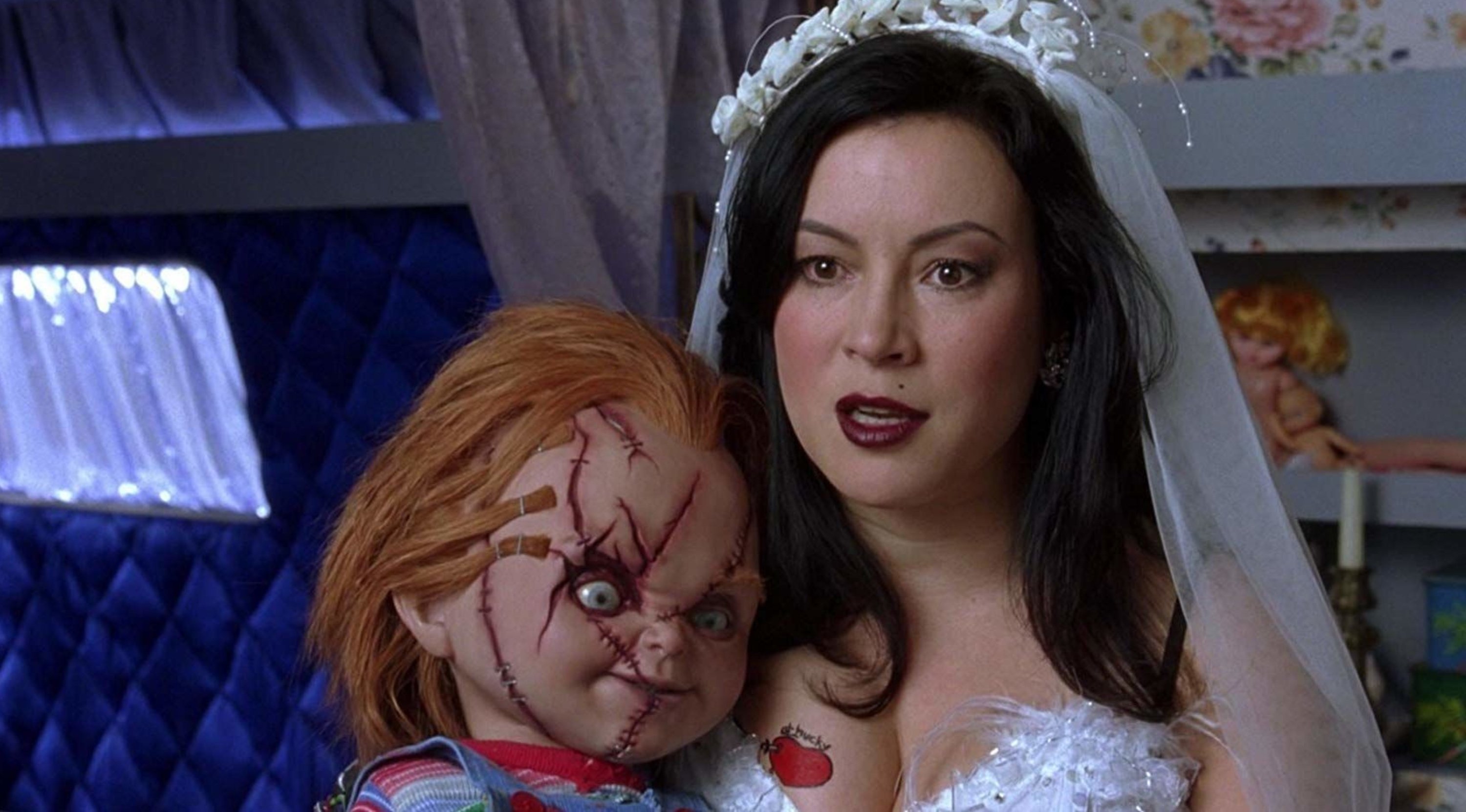 Characters Chucky and Tiffany Valentine in 'Child's Play' franchise wearing wedding dress