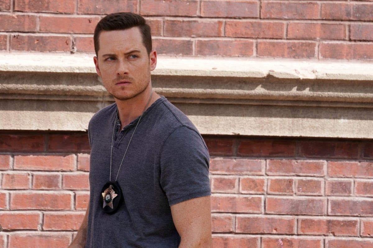 Jesse Lee Soffer as Jay Halstead in Chicago P.D. Season 9. Halstead is wearing a t-shirt and badge.