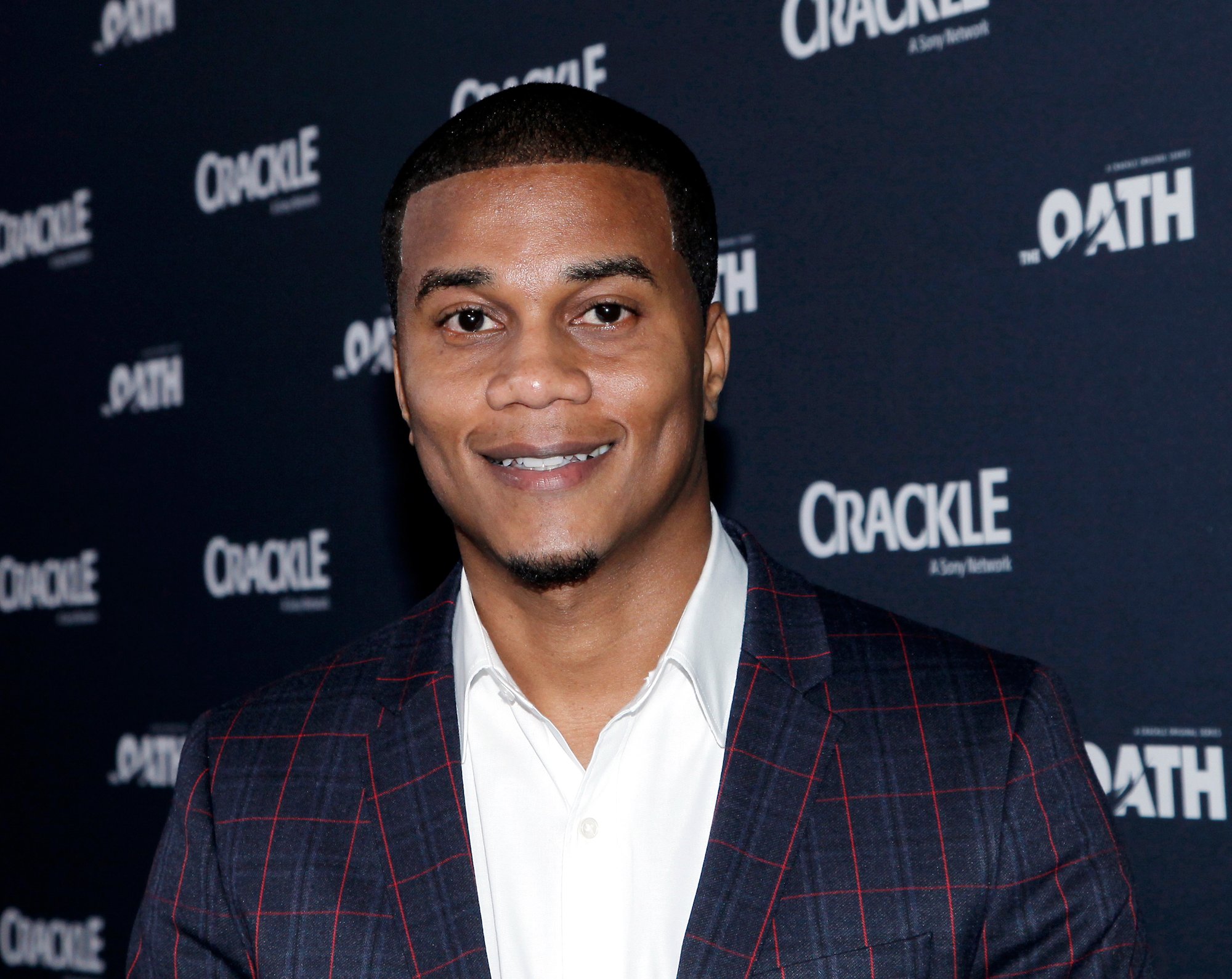 Cory Hardrict wearing a blue and red suit to the premiere of Crackle's 'The Oath.'