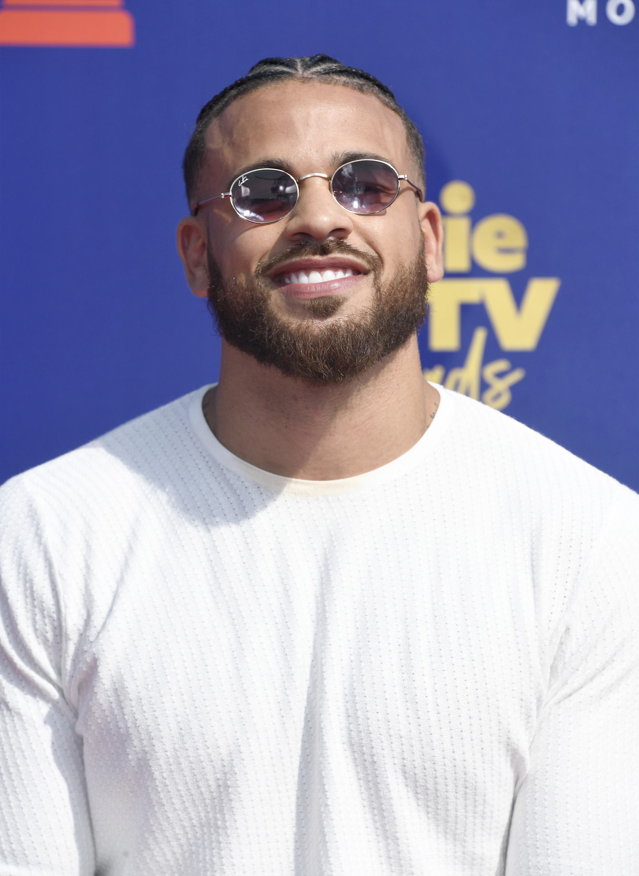 Cory Wharton in sunglasses smiling at an event. Cory Wharton will not be part of 'The Challenge' Season 38 cast