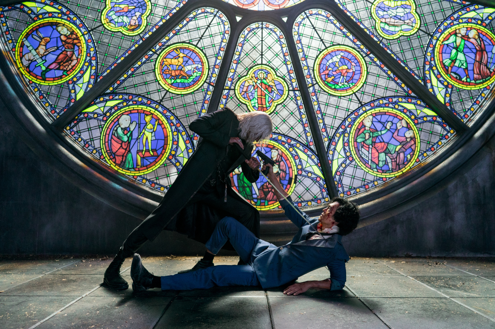 Vicious and Spike Spiegel fight in front of a stain-glass window in Netflix's live-action 'Cowboy Bebop' series, which is getting negative early reviews.