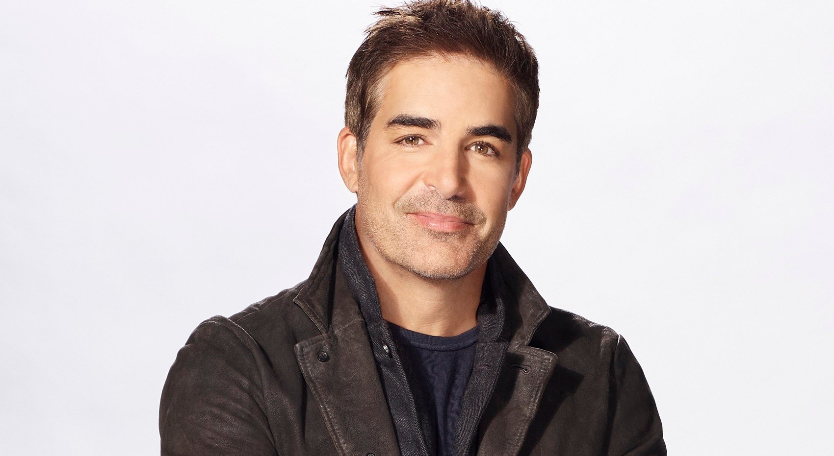 Days of Our Lives spoilers focus on Rafe, pictured here in a brown leather jacket