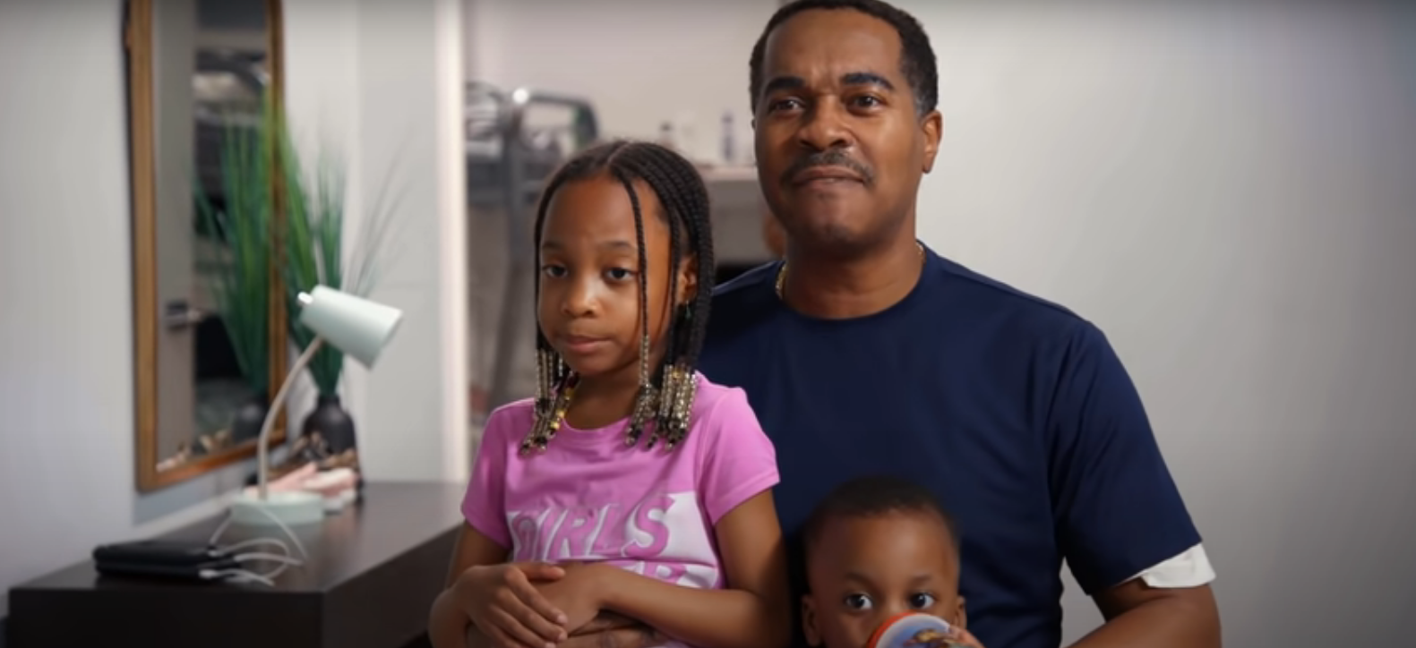 Deon Derrico with his arms around two of his children in 'Doubling Down With the Derricos'