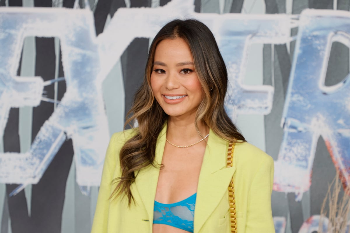 Jamie Chung attends the world premiere of Dexter: New Blood. Chung is wearing a yellow pantsuit.