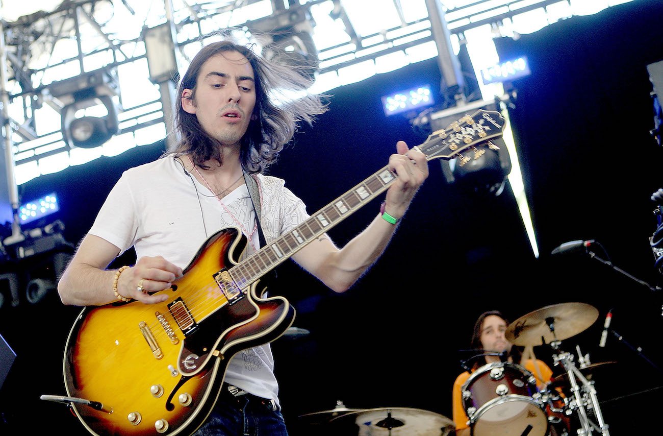 Dhani Harrison wearing a white shirt during his performance at Coachella in 2009.