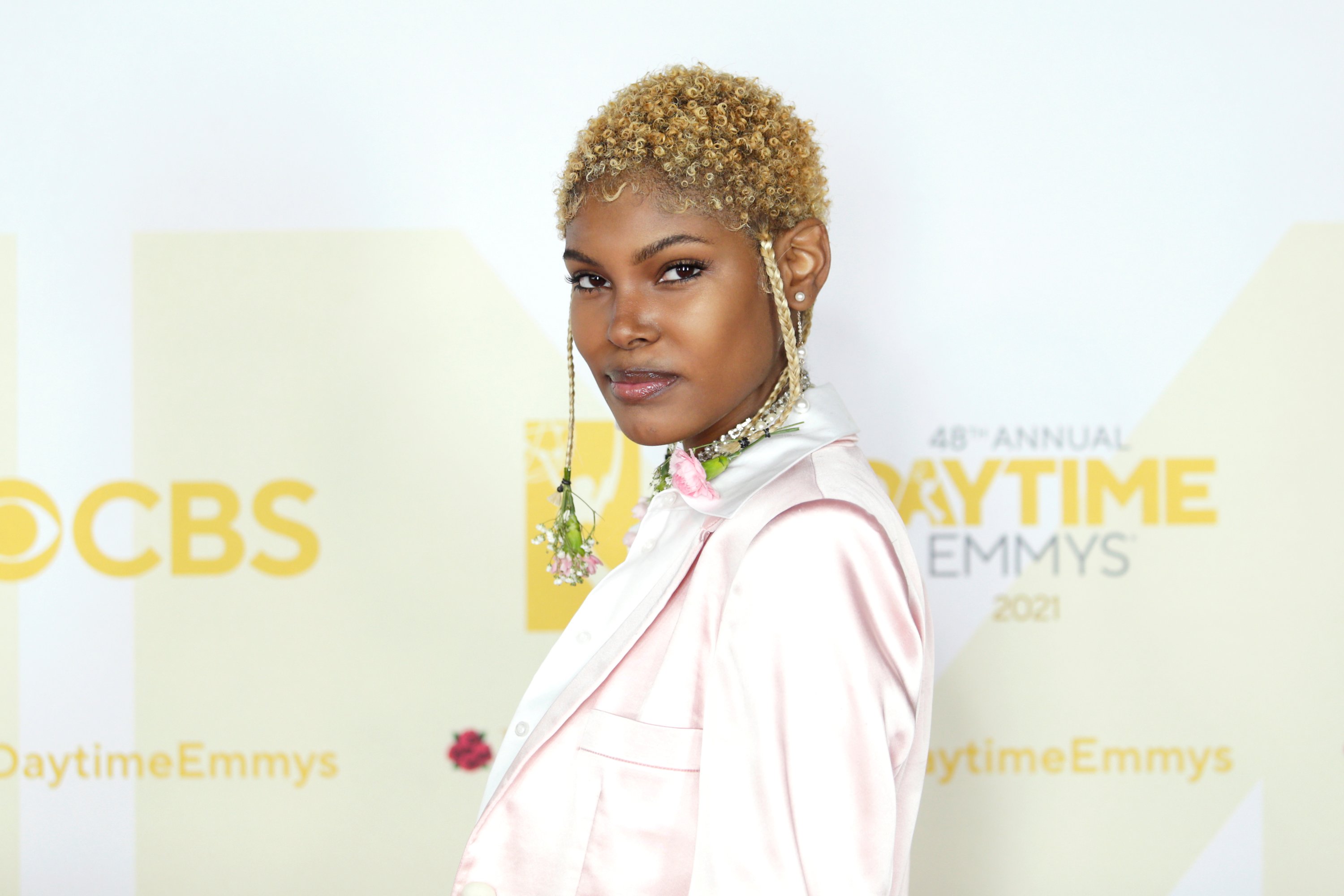 'The Bold and the Beautiful' star Diamond White wearing a white pantsuit and posing for photographers.