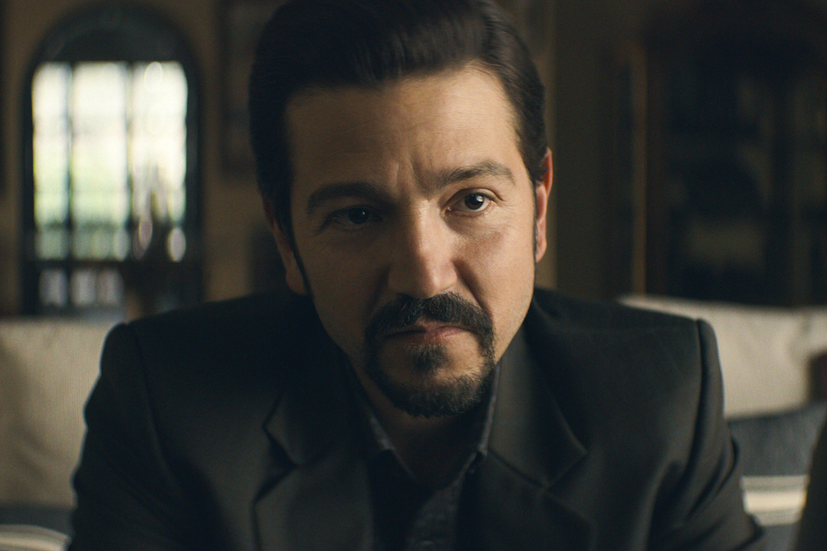Diego Luna dressed in a black suit in 'Narcos: Mexico' Season 2.