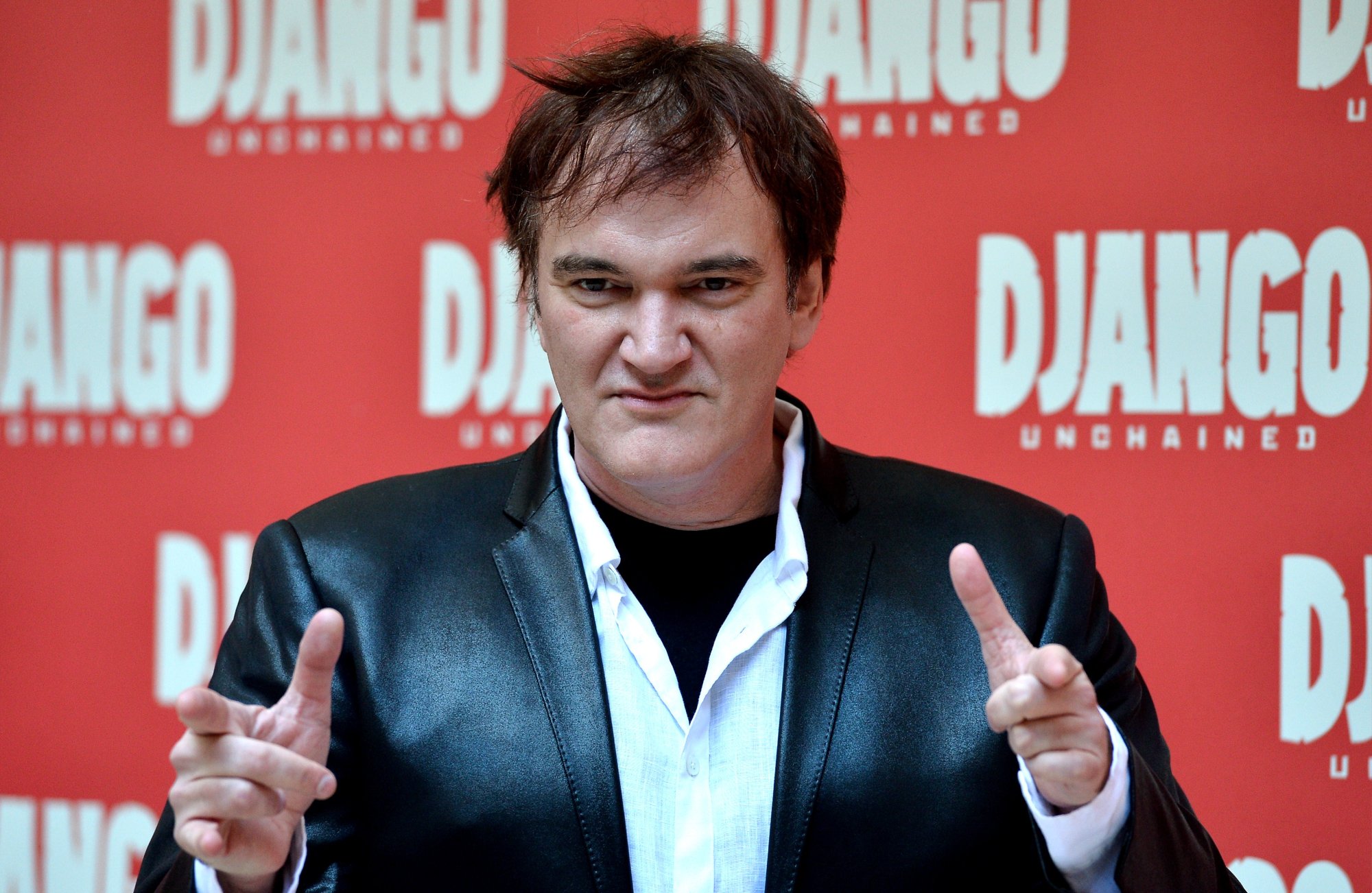 'Django Unchained' filmmaker Quentin Tarantino at photocall pointing at the camera