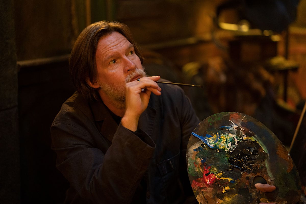 Donal Logue holding a palette in an episode of 'What We Do in the Shadows'