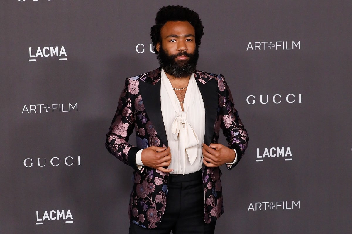 Donald Glover wearing a purple and white suit