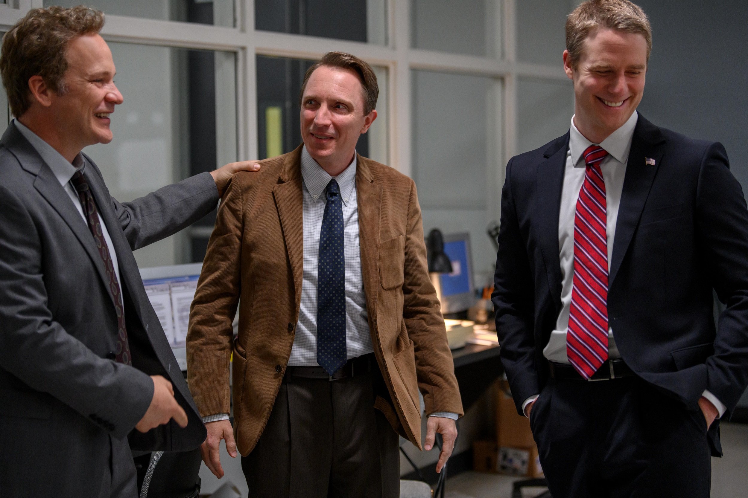 'Dopesick' Episode 8 cast members Peter Sarsgaard playing Rick Mountcastle, John Hoogenakker as Randy Ramseyer and Jake McDorman as John Brownlee laughing and smiling together