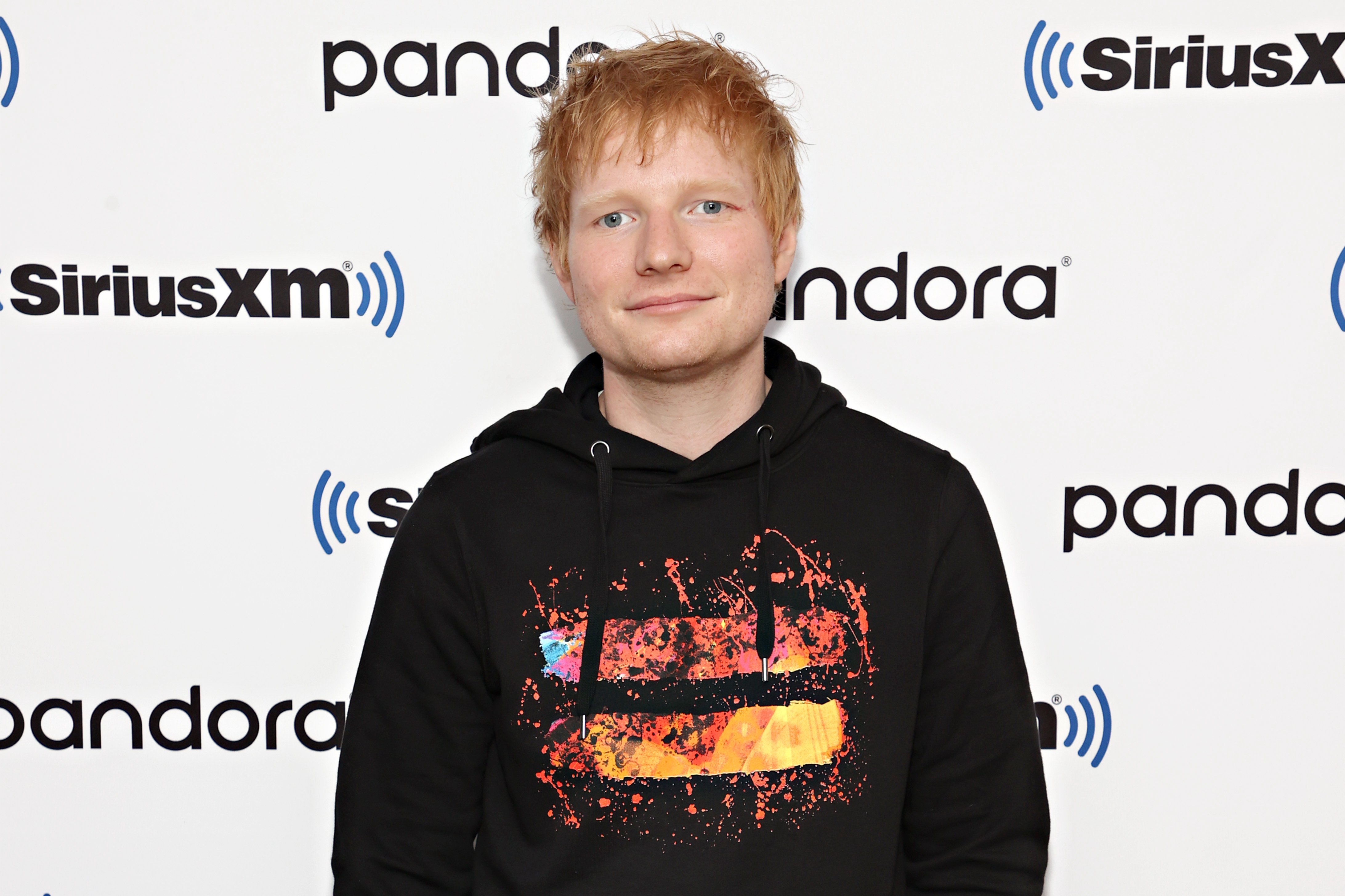 Ed Sheeran poses on the carpet for SiriusXM