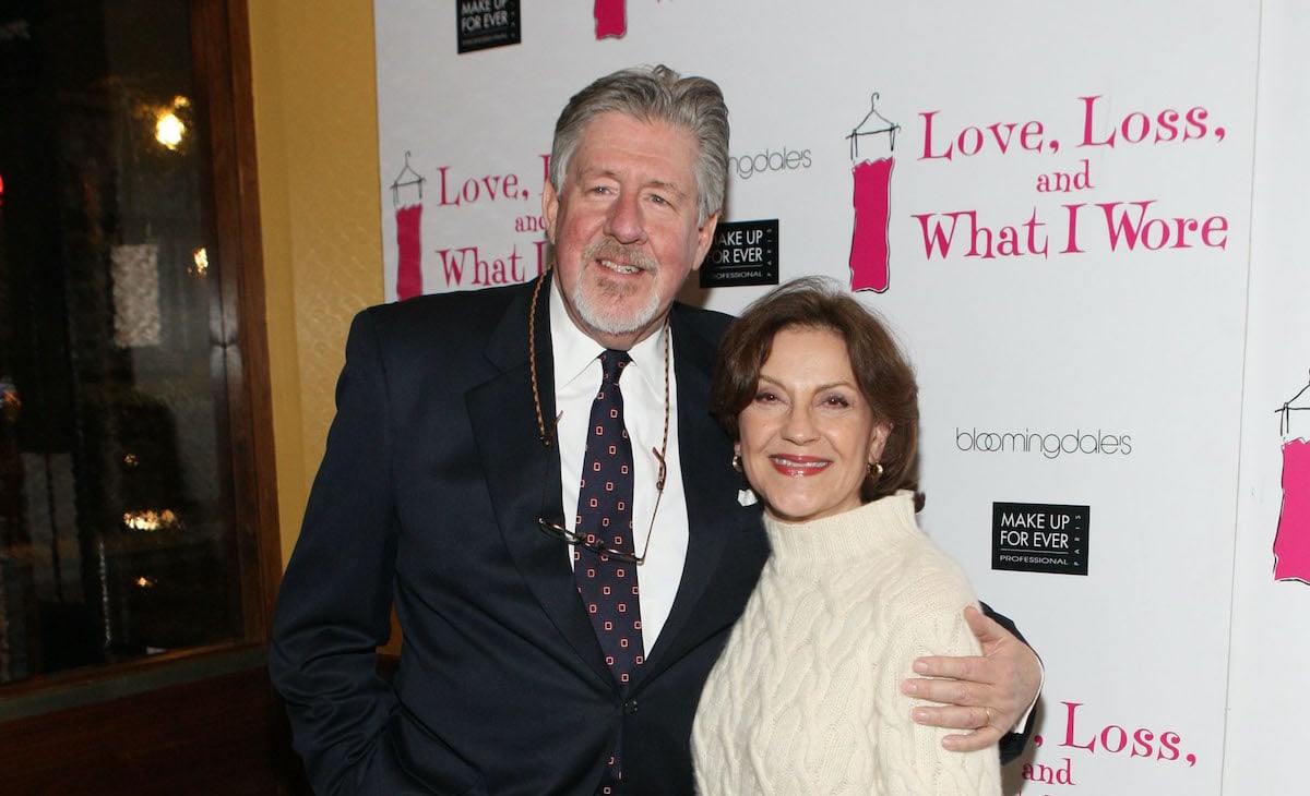 Edward Herrmann and Kelly Bishop embracing and smiling