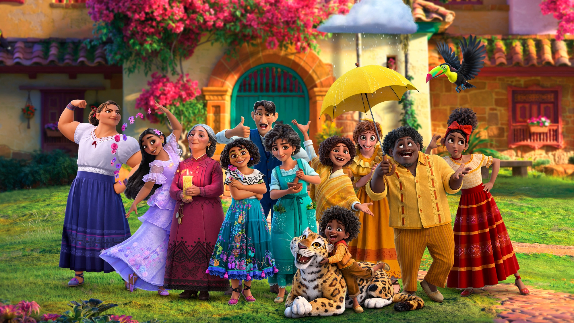 'Encanto' review group Mirabel (Stephanie Beatriz), María Cecilia Botero as Mirabel’s grandmother, Abuela Alma; Angie Cepeda and Wilmer Valderrama as Mirabel’s parents, Julieta and Agustín; Jessica Darrow and Diane Guererro as Mirabel’s sisters Luisa and Isabela; Carolina Gaitan and Mauro Castillo as Mirabel’s aunt and uncle, Pepa and Félix; and Adassa Candiani, Rhenzy Feliz and Ravi Cabot-Conyers as Mirabel’s cousins Dolores, Camilo and Antonio posing in front of their magical house