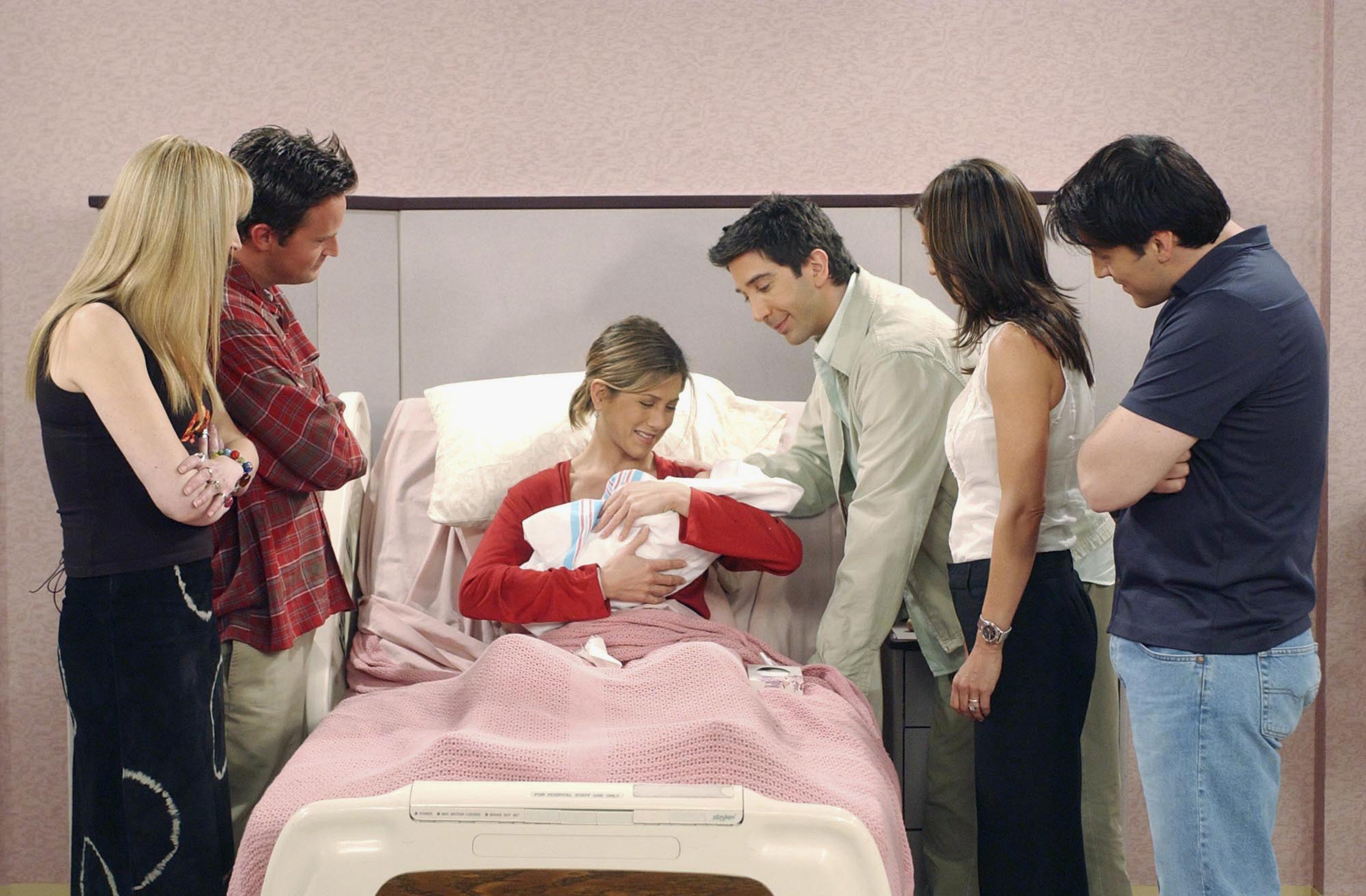 The cast of 'Friends' stand around Rachel Green after the birth of Emma