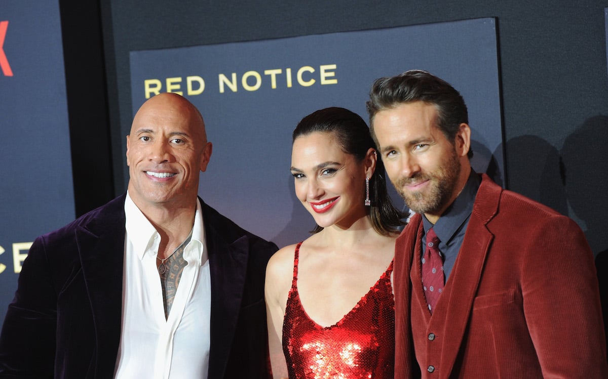 Gal Gadot, Dwayne Johnson, Ryan Reynolds wearing formal clothing at 'Red Notice' premiere