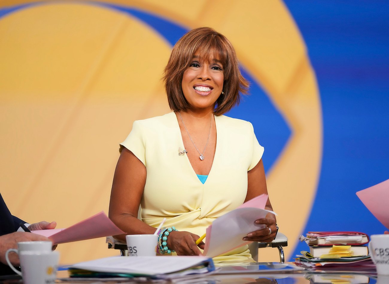 Gayle King smiles wearing a yellow outfit on 'CBS This Morning'