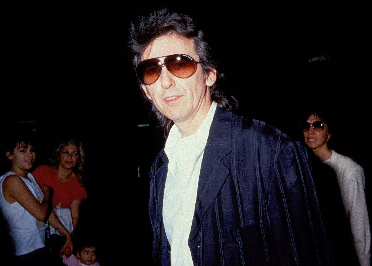 George Harrison wearing sunglasses at LAX Airport in 1988.