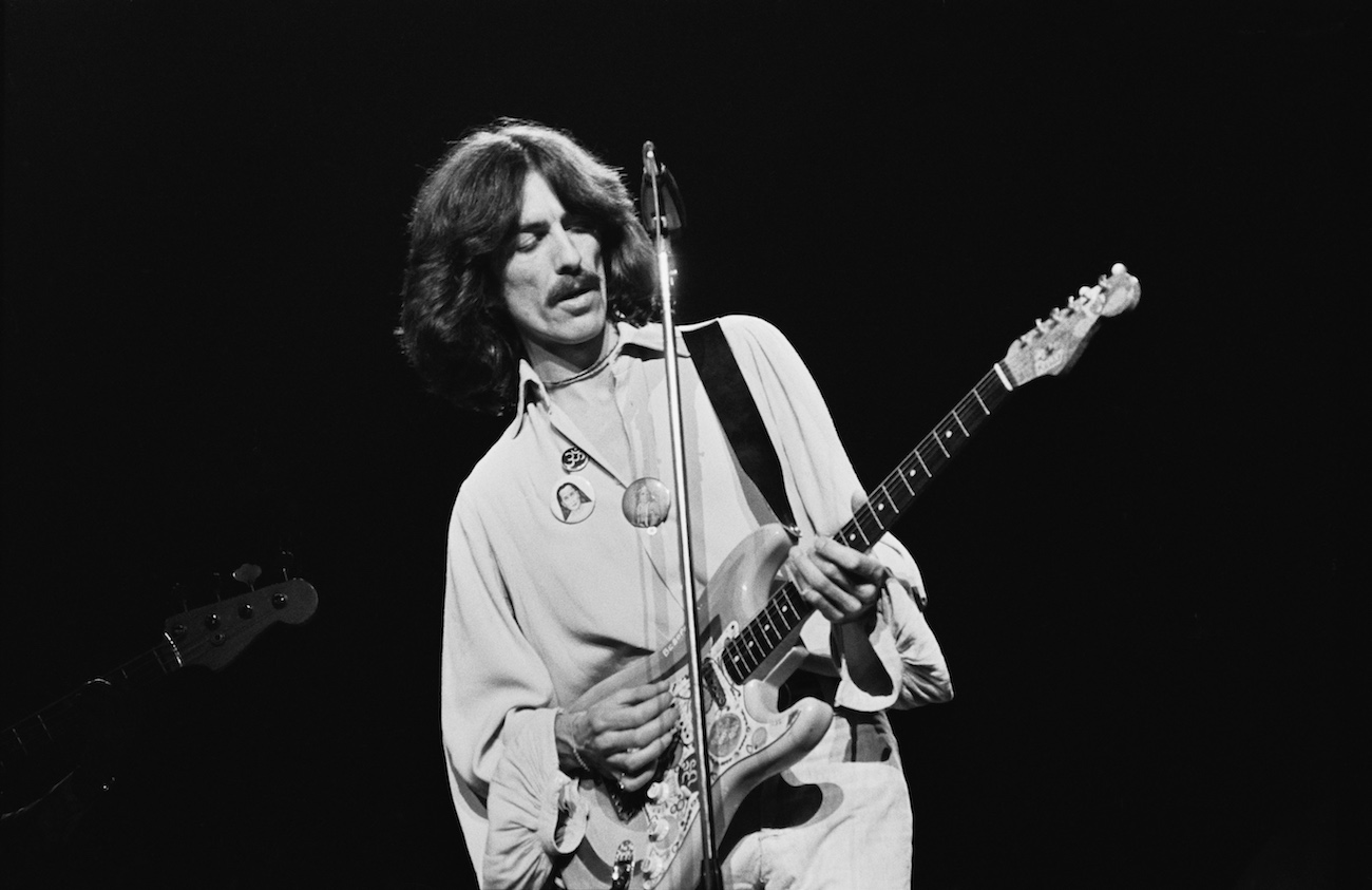 George Harrison playing his guitar 'Rocky' during a performance in his Dark Horse tour in 1974.