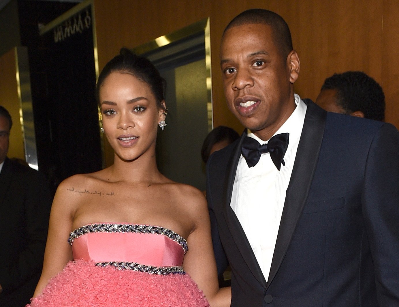 Rihanna (L) and Jay-Z posing together