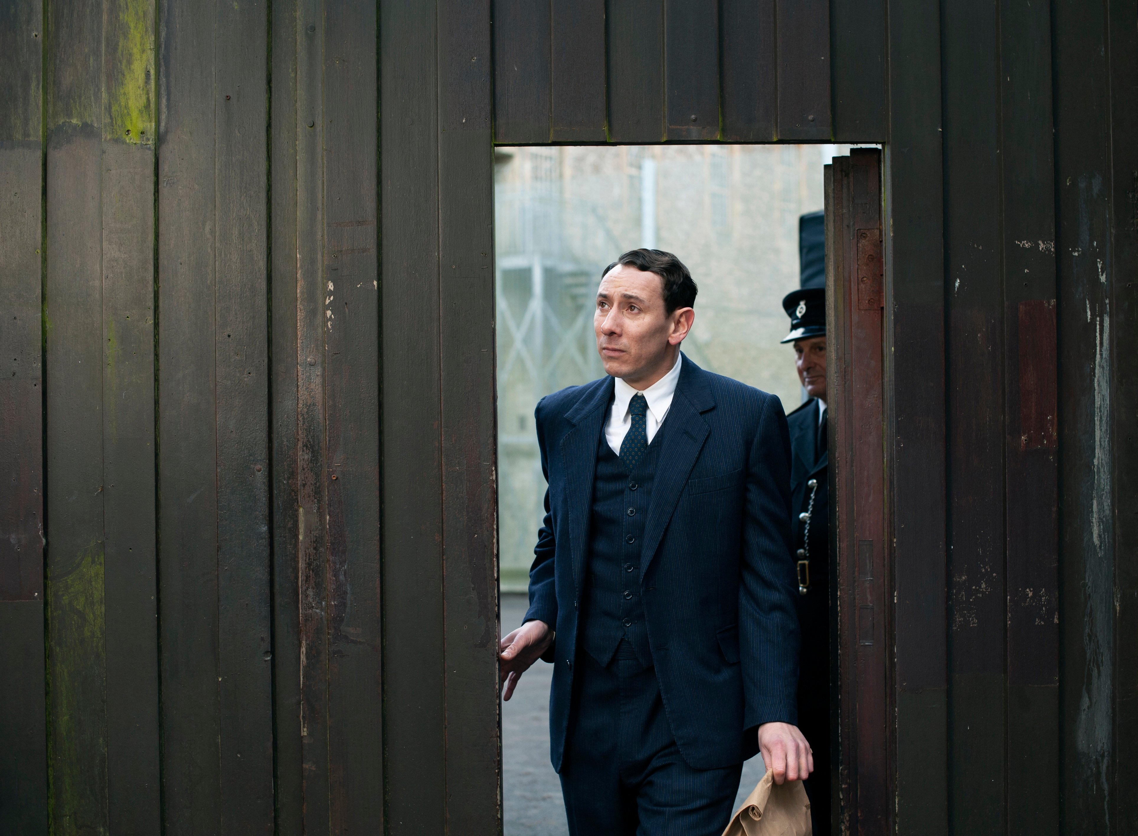 Leonard walking through a doorway in the 'Grantchester' Season 6 finale