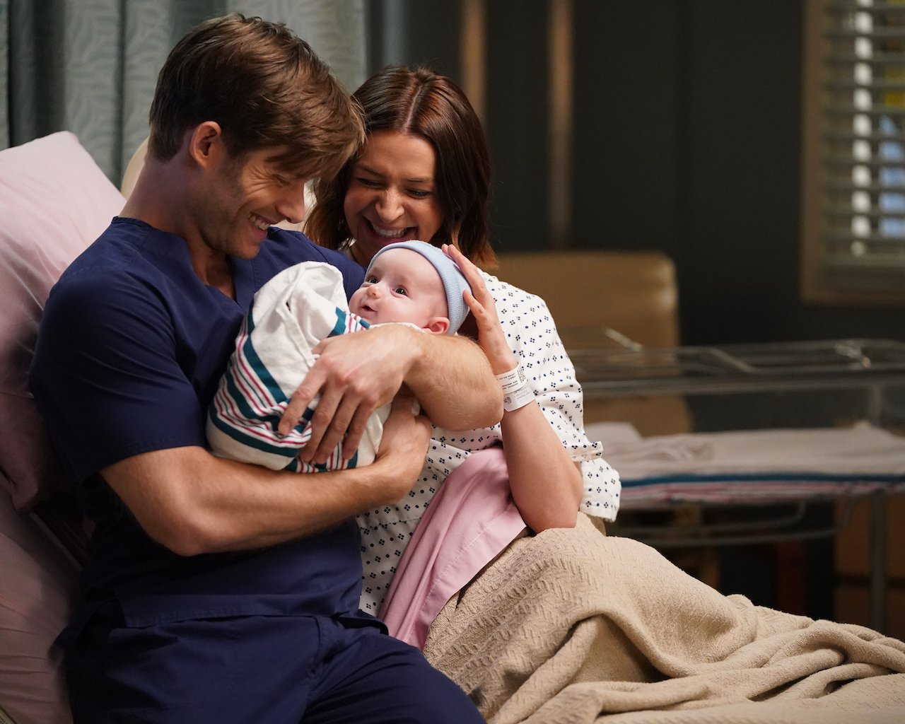Amelia and Link are in the hospital bed with their newborn on 'Grey's Anatomy'
