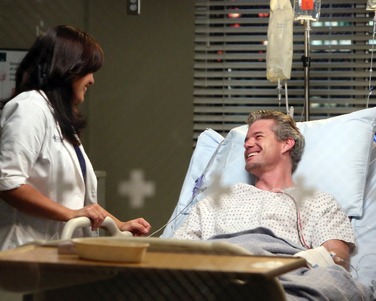 Sara Ramirez as Callie Torres visits Eric Dane as Mark Sloan on his hospital bed in 'Grey's Anatomy'