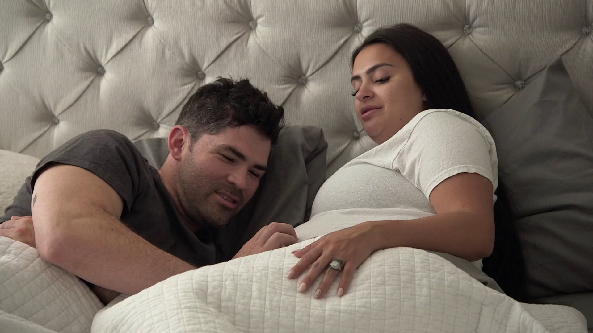 Gus Gazda and Nilsa Prowant lay together in bed in an episode of 'Floribama Shore'