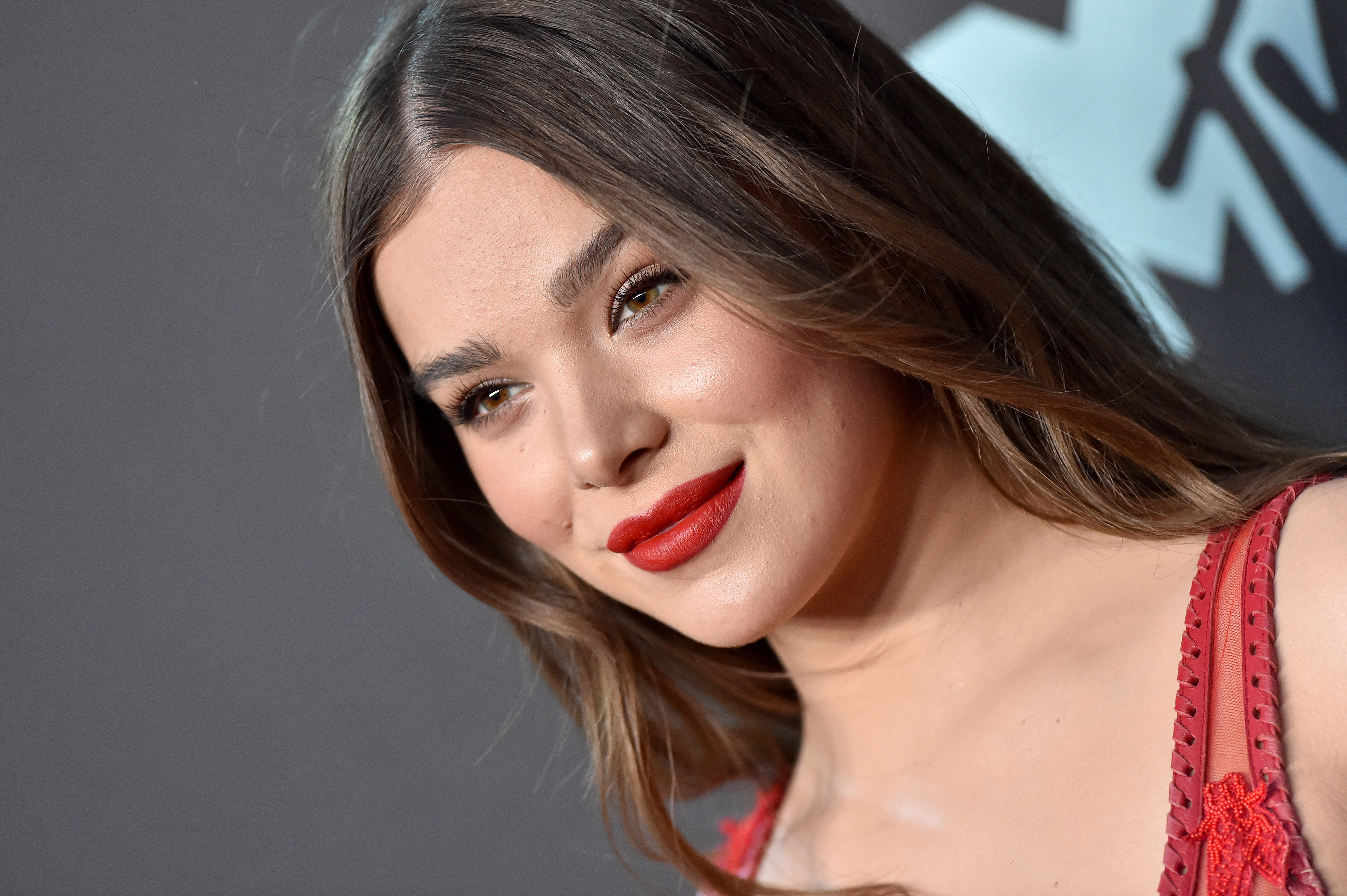 'Hawkeye' actor Hailee Steinfeld, who stars alongside Florence Pugh in the Marvel Disney+ series, wears a red dress with thin straps and red lipstick.