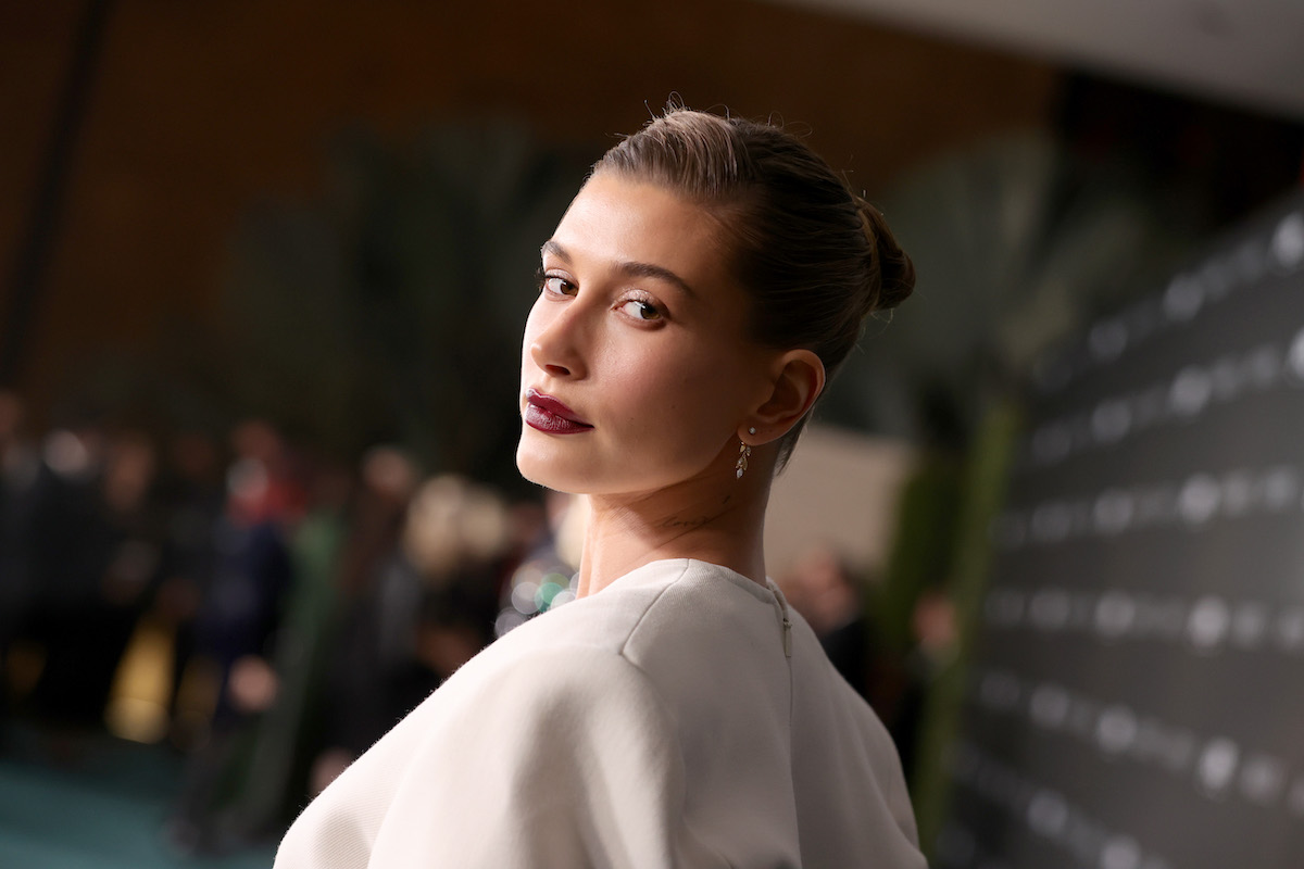 Hailey Bieber poses for the camera at an event.