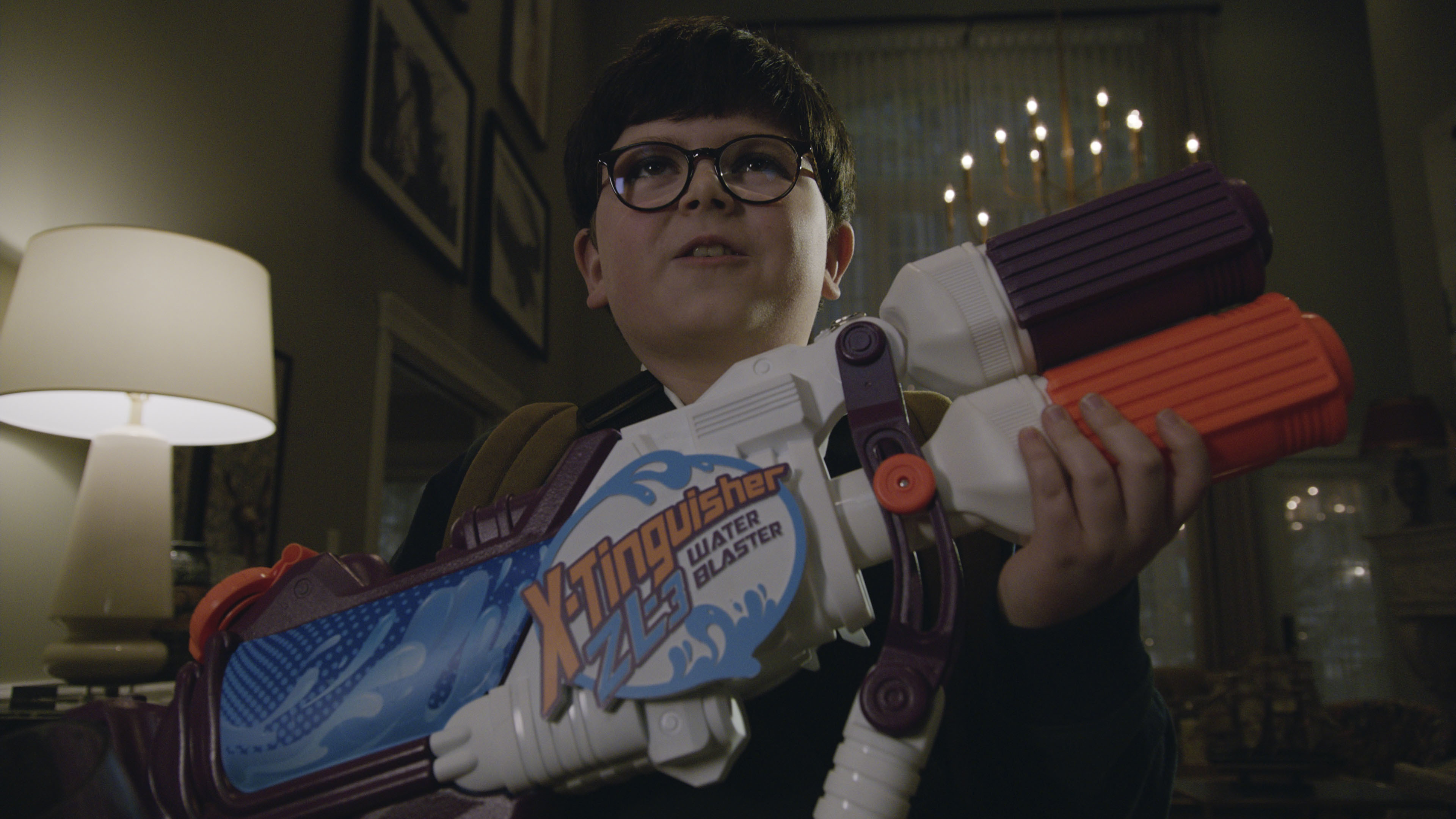'Home Sweet Home Alone': Archie Yates holds his water gun