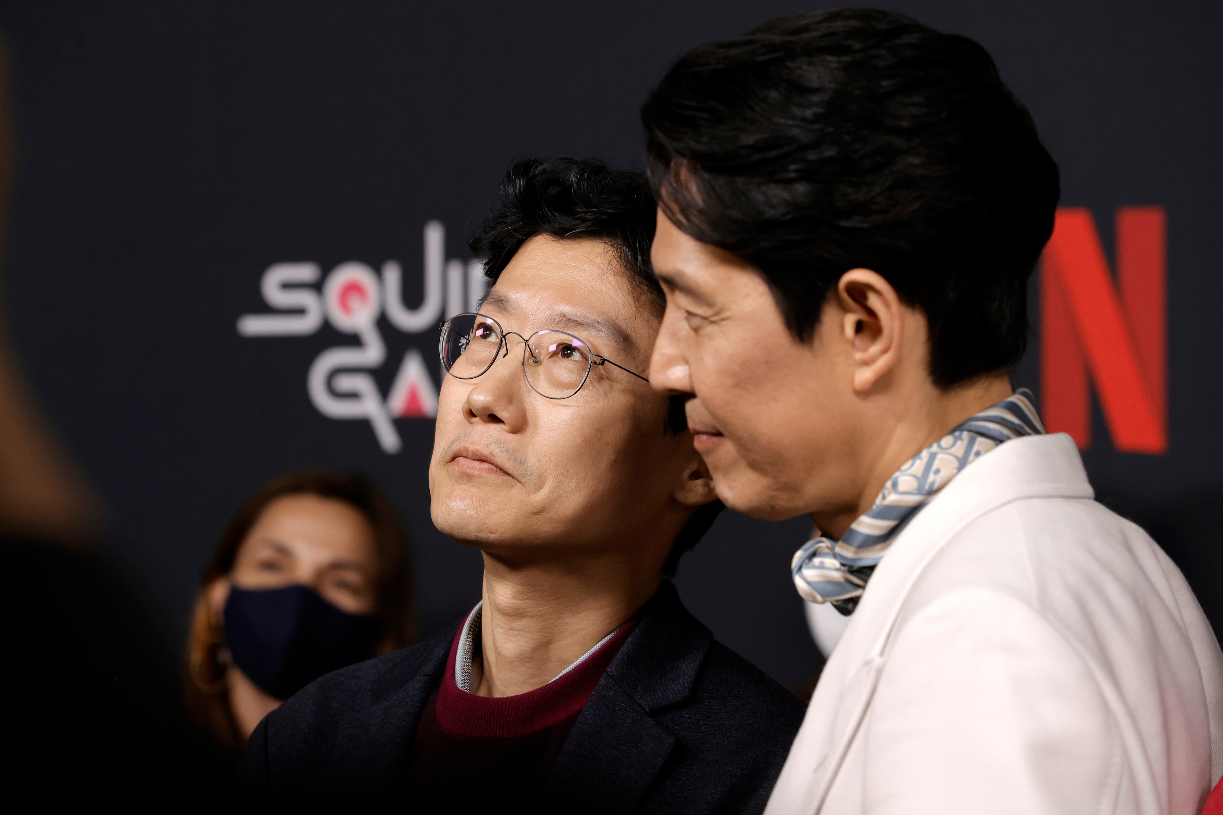 Hwang Dong-hyuk and Lee Jung-jae for 'Squid Game' at red carpet premiere.