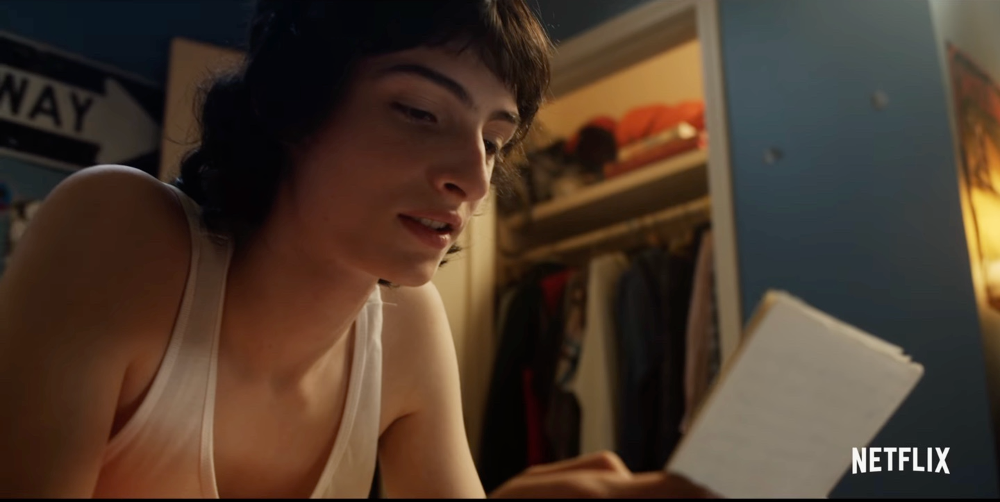 Mike Wheeler in a tank top reading a letter from Eleven in 'Stranger Things' Season 4 teaser released on Stranger Things Day