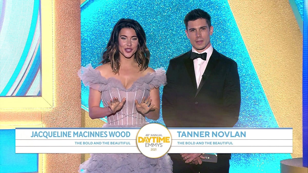 'The Bold and the Beautiful' actor Jacqueline MacInnes Wood in a lavender dress, and Tanner Novlan in a tuxedo; onstage at the 2021 Daytime Emmys.